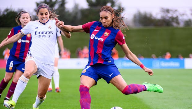 MADRID, SPAIN - MARCH 24: Salma Paralluelo of FC Barcelona (R) attempts a kick while is chased by Kenti Robles of Real Madrid CF Femenino (L) during Spanish Women's League F match between Real Madrid and FC Barcelona at Estadio Alfredo Di Stefano on March 24, 2024 in Madrid, Spain. (Photo by Alberto Gardin/Eurasia Sport Images/Getty Images)