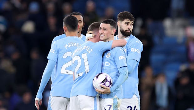 MANCHESTER, ENGLAND - APRIL 03: Phil Foden of Manchester City celebrates victory on pitch with the match ball after scoring a hat-trick during the Premier League match between Manchester City and Aston Villa at Etihad Stadium on April 03, 2024 in Manchester, England. (Photo by Alex Livesey/Getty Images)