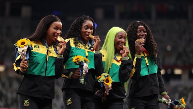 TOKYO, JAPAN - AUGUST 07: Gold medal winners Briana Williams, Elaine Thompson-Herah, Shelly-Ann Fraser-Pryce and Shericka Jackson of Team Jamaica stand on the podium during the medal ceremony for the Women’s 4 x 100m Relay on day fifteen of the Tokyo 2020 Olympic Games at Olympic Stadium on August 07, 2021 in Tokyo, Japan. (Photo by Christian Petersen/Getty Images)