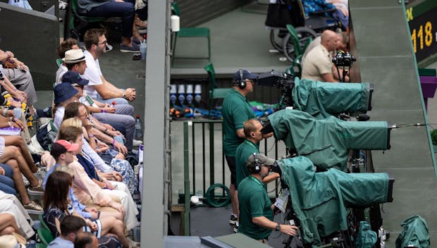 LONDON, ENGLAND - JULY 05: Television cameras and crowd during the Mens Singles Quarter-Final between Novak Djokovic of Serbia and Jannik Sinner of Italy at The Wimbledon Lawn Tennis Championship at the All England Lawn and Tennis Club at Wimbledon on July 5th, 2022 in London, England. (Photo by