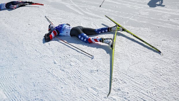 ZHANGJIAKOU, CHINA - FEBRUARY 20: Tiril Udnes Weng of Team Norway, Cendrine Browne of Team Canada and Novie McCabe of Team United States al collapse after crossing the finish line during the Women's Cross-Country Skiing 30k Mass Start Free on Day 16 of the Beijing 2022 Winter Olympics at The National Cross -Country Skiing Centre on February 20, 2022 in Zhangjiakou, China. (Photo by